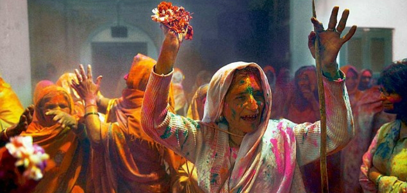 Widows enjoy playing holi in Vrindavan Temple