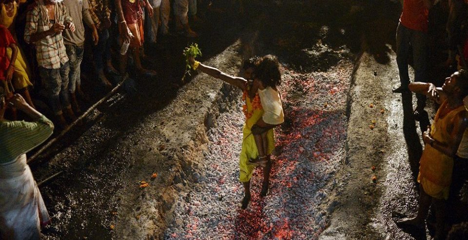 Father drops son on red-hot coal during Hindu ritual - Mango News Father drops son on red-hot coal during Hindu ritual-1