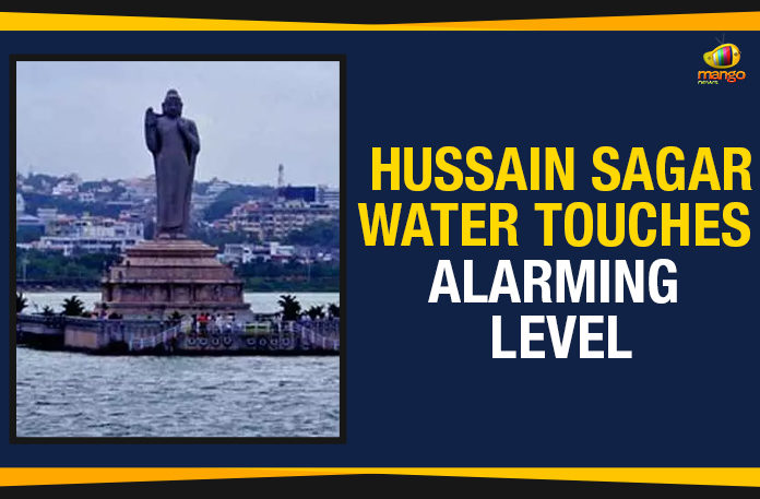 Hussain-Sagar---Water-Touches-Alarming-Level Greater Hyderabad Municipal Corporation, Heavy rains in Hyderabad, Hussain Sagar Reached To Full Capacity, Hussain Sagar Reached To Full Capacity Water Released, Hussain Sagar Reached To Full Capacity Water Released Into Musi Canal, Hussain Sagar Water Touches Alarming Level, Hyderabad Heavy Rains, Mango News, Political Updates 2019, Telangana, Telangana Breaking News, Water Released Into Musi Canal