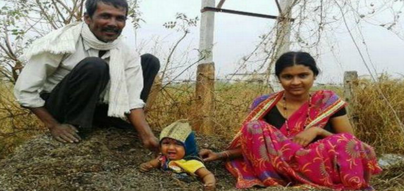 Couple partially buried child in compost pit during solar eclipse