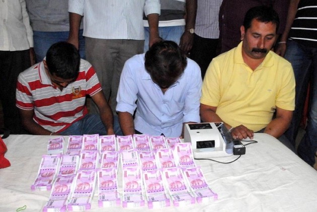 ED officials with middlemen.