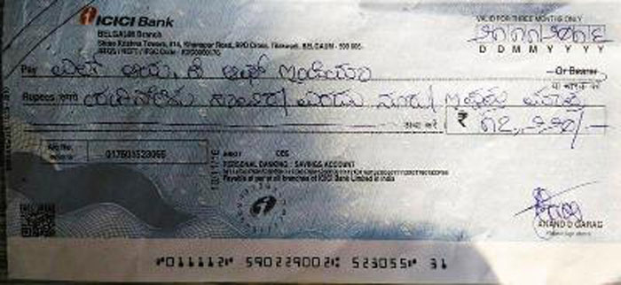 Cheque in Kannada given to the LIC by customer Garag.
