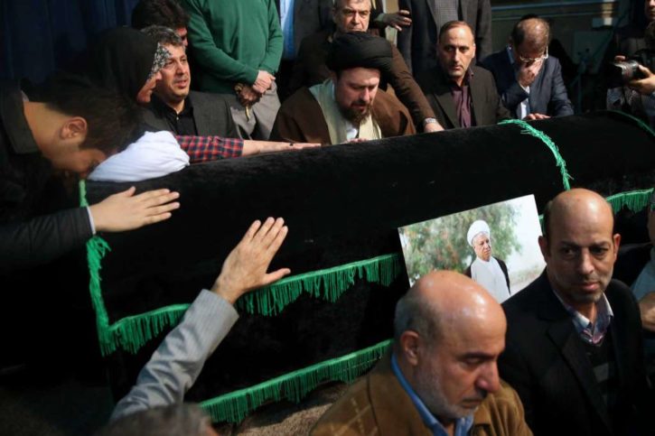Hassan Khomeini, center, grandson of Iran's late revolutionary founder Ayatollah Khomeini, mourns over the coffin of former President Akbar Hashemi Rafsanjani at the Jamaran mosque in northern Tehran, Iran.