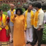 AP Special Status Protest: TDP MP Dresses Up As Sathya Sai Baba, Mp Sivaprasad Dressed Up As Sathya Sai Baba, Andhra Pradesh Special Status, Tdp MPs continue their protest for AP special status, Monsoon Session of Parliament updates, Telugu Desam Party Latest News, Mango News, Andhra Pradesh Latest News, TDP Party Latest Updates