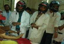 Osmania Hospital’s Doctors Wear Helmets Osmania Hospital’s Doctors Wear Helmets, OGH roofs crumbling doctors treat patients in the open, Doctors at Osmania Hospital wore helmets, Mango News, Osmania Government Hospital Latest News, Osmania Hospital Staff And Patients Wearing Helmets, Hyderabad Osmania General Hospital roof falls, Osmania Hospital reconstruction