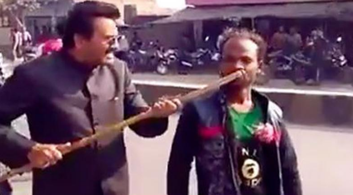 Uttar Pradesh – BJP Leader Assaults Specially Abled Man, BJP leader beats specially abled man, Mango News, BJP leader misbehaviour in UP, specially abled man criticize BJP, Akhilesh Yadav Samajwadi Party latest news, case registered against BJP leader, Mohammad Miya abusing man, BJP leader attacking disabled man in UP