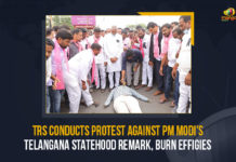 TRS Conducts Protest Against PM Modi’s Telangana Statehood Remark, Burn Effigies TRS,TRS Conducts Protest Against PM Modi's Telangana Statehood Remark Burn Effigies, TRS Conducts Protest Against PM Modi's Telangana Statehood Remark, TRS Conducts Protest Against PM Modi's Telangana Statehood Remark Burn And Effigies, TRS activists held protests across the former Karimnagar district, PM Modi's Telangana-Andhra Pradesh Bifurcation Comments In Parliament, KTR Demands Apology, Telangana-Andhra Pradesh Bifurcation Comments, Working President of Telangana demanded an apology from Narendra Modi, Narendra Modi, Prime Minister of India, KTR, KT Rama Rao, Working President of Telangana, comments of Narendra Modi during the parliament, PM Narendra Modi's remarks on Telangana in Parliament, Mango News, PM Modi's Telangana Statehood Remark Burn Effigies, PM Modi,