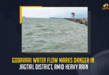 Godavari Water Flow Marks Danger In Jagtial District Amid Heavy Rain, Godavari Water Flow Marks Danger In Jagtial District, Jagtial District, Godavari river is flowing at danger mark at Dharmapuri temple in its catchment areas during the last four days, water levels at Dharmapuri reached the danger mark amid flood situations, Godavari flows above danger mark, swollen Godavari flowed perilously above the danger mark, Telangana's Jagtial district, Godavari Water flows above danger mark, Godavari Water Flow News, Godavari Water Flow Latest News, Godavari Water Flow Latest Updates, Godavari Water Flow Live Updates, Mango News,