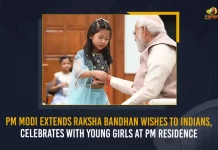 PM Modi Extends Raksha Bandhan Wishes To Indians Celebrates With Young Girls At PM Residence, PM Modi Celebrates Raksha Bandhan with Youngsters at his Residence in New Delhi, Prime Minister Narendra Modi Celebrates Raksha Bandhan with Youngsters at his Residence in New Delhi, Narendra Modi celebrates Raksha Bandhan with daughters of PMO staff, Raksha Bandhan with Youngsters, Prime Minister Narendra Modi, PM Modi, Raksha Bandhan, Raksha Bandhan Wishes, Raksha Bandhan Greetings, 2022 Raksha Bandhan, PM Modi News, PM Modi Latest News, PM Modi Latest Updates, PM Modi Live Updates, Mango News,