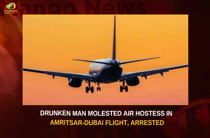Drunk Passenger Arrested For Molesting Air Hostess In Flight,Drunk Passenger Arrested,Drunk Passenger Arrested For Molesting Air Hostess,Drunk Passenger Arrested In Flight,Mango News,Drunk Passenger Molests Air Hostess,Drunk Male Passengers Molests Cabin Crew,Drunk male passenger molests air hostess,Drunk man flying from Dubai arrested,Passenger in inebriated state arrested in Amritsar,air hostess in a Amritsar to Dubai flight
