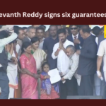 Revanth Reddy initiate the six guarantees with his first sign as CM,Revanth Reddy initiate the six guarantees,six guarantees with his first sign as CM,six guarantees first sign,CM Revanth Reddy, Telangana, CMO, KCR, KTR,Mango News,Congress Revanth Reddy,Revanth Reddy Latest News,Revanth Reddy Latest Updates,Revanth Reddy Live News,Telangana Congress six guarantees Latest News,Telangana Congress six guarantees Latest Updates