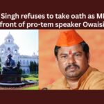 Raja Singh refuses to take oath as MLA in front of pro tem speaker Owaisi,Raja Singh refuses to take oath,Take oath as MLA,MLA in front of pro tem speaker,pro tem speaker Owaisi,Mango News,Telangana Guv appoints Akbaruddin Owaisi,AIMIMs Akbaruddin Owaisi,Telangana BJP MLAs refuses,Pro tem Speaker Akbar,Pro tem Speaker Latest News,Pro tem Speaker Latest Updates,Pro tem Speaker Live News,Raja Singh Latest News,Raja Singh Latest Updates,Raja Singh Live News,Telangana Latest News And Updates,Telangana Politics, Telangana Political News And Updates
