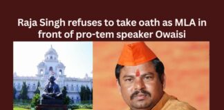 Raja Singh refuses to take oath as MLA in front of pro tem speaker Owaisi,Raja Singh refuses to take oath,Take oath as MLA,MLA in front of pro tem speaker,pro tem speaker Owaisi,Mango News,Telangana Guv appoints Akbaruddin Owaisi,AIMIMs Akbaruddin Owaisi,Telangana BJP MLAs refuses,Pro tem Speaker Akbar,Pro tem Speaker Latest News,Pro tem Speaker Latest Updates,Pro tem Speaker Live News,Raja Singh Latest News,Raja Singh Latest Updates,Raja Singh Live News,Telangana Latest News And Updates,Telangana Politics, Telangana Political News And Updates